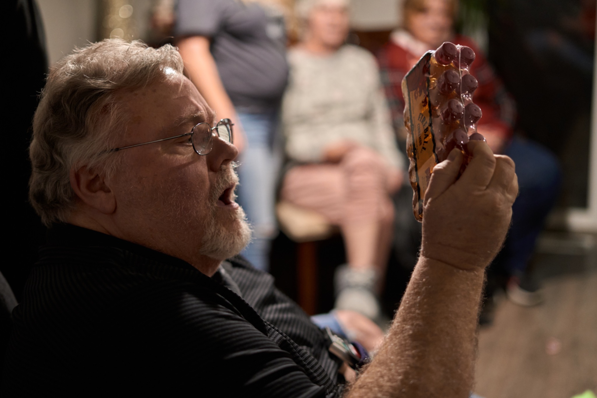 A man examining a novelty gift during the exchange